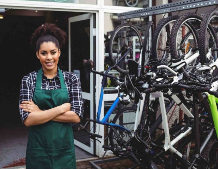 Smiling mechanic standing with arms crossed