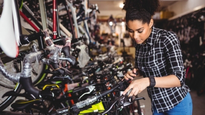 Mechanic examining bicycles