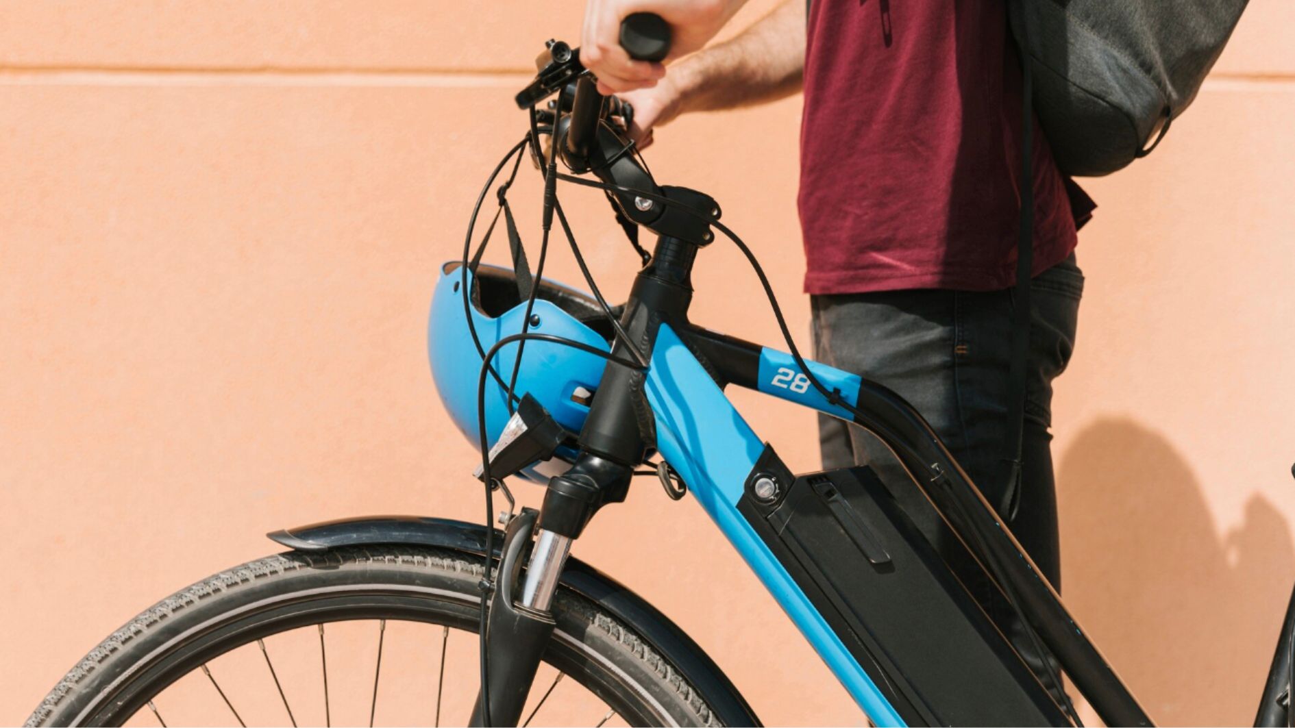 rent bike Faro, cyclist standing next to e-bike